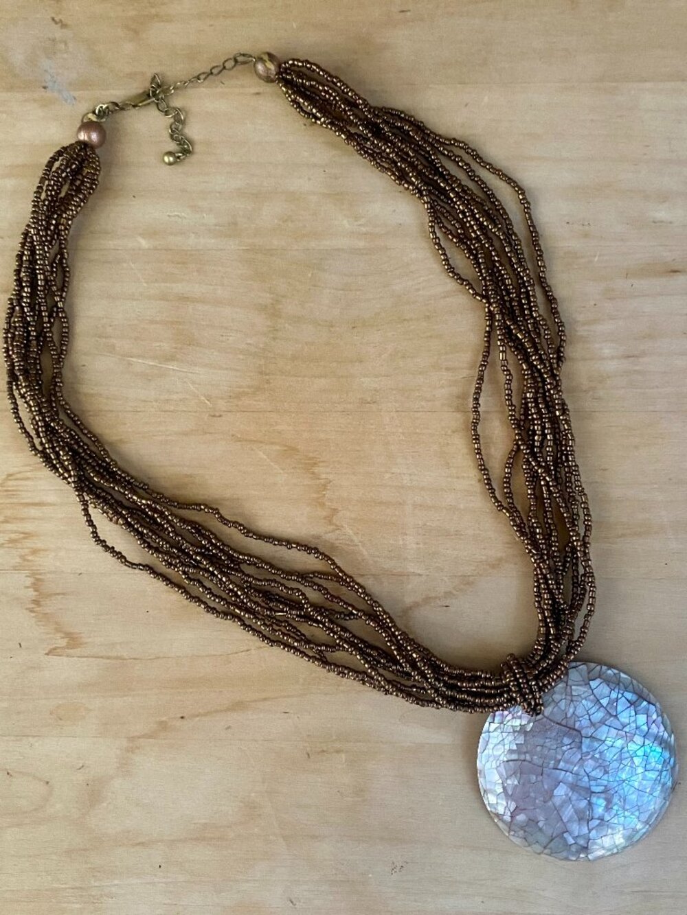 Vintage statement necklace - seed beads and mother of pearl style pendant.